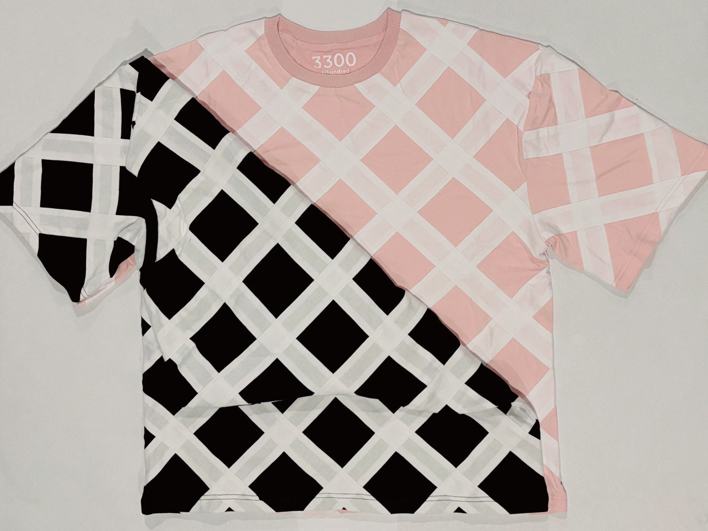 Pink and black four-layer lattice tees overlapping on a white background