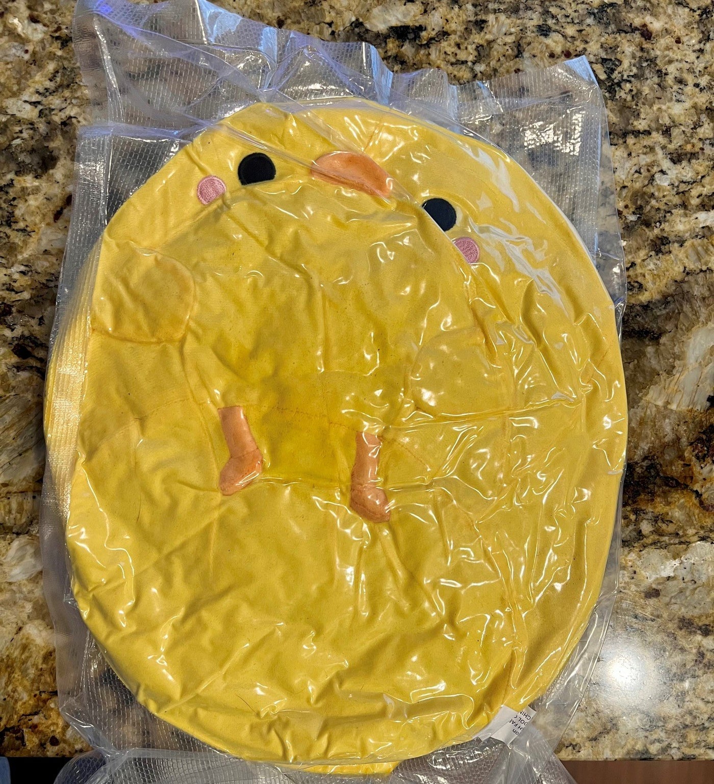Henry plush flattened inside a clear shipping bag
